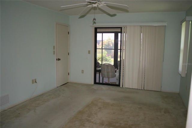 carpeted empty room with ceiling fan