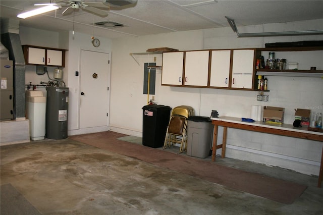 garage with electric water heater and ceiling fan