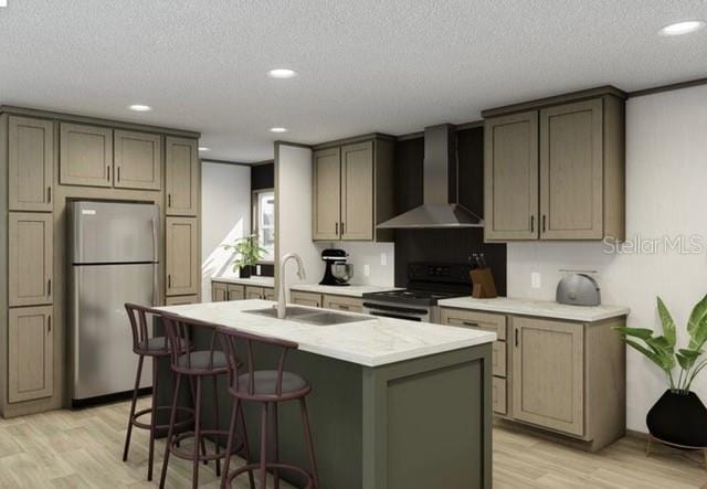 kitchen with wall chimney exhaust hood, stainless steel fridge, electric range oven, light wood-type flooring, and sink