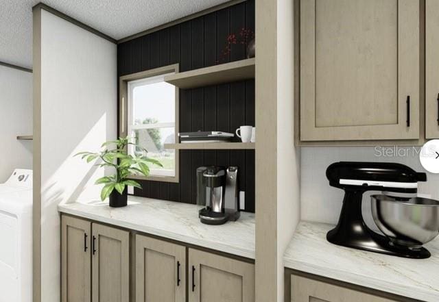 room details featuring washer / clothes dryer, a textured ceiling, and vanity