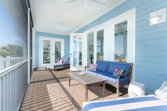 sunroom / solarium with ceiling fan and french doors