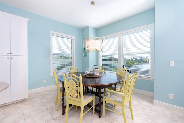 dining area featuring light tile patterned floors