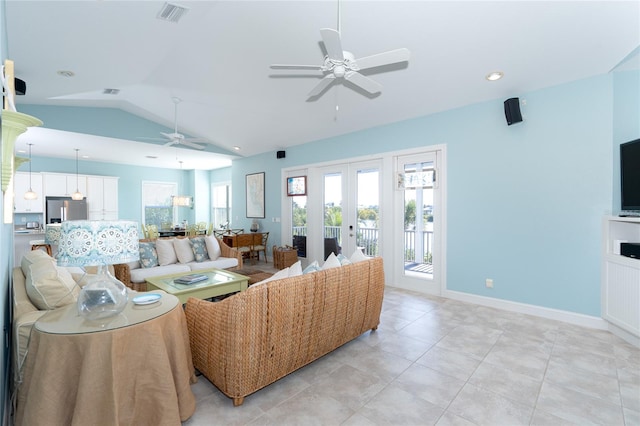 living room featuring light tile patterned flooring, french doors, vaulted ceiling, and ceiling fan