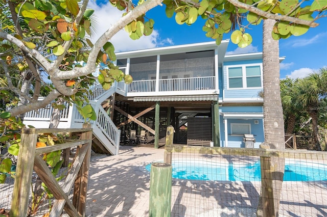 rear view of property featuring a patio