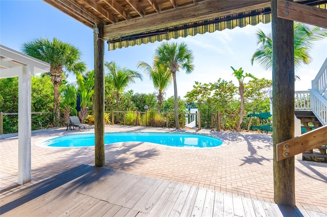 view of swimming pool featuring a patio area