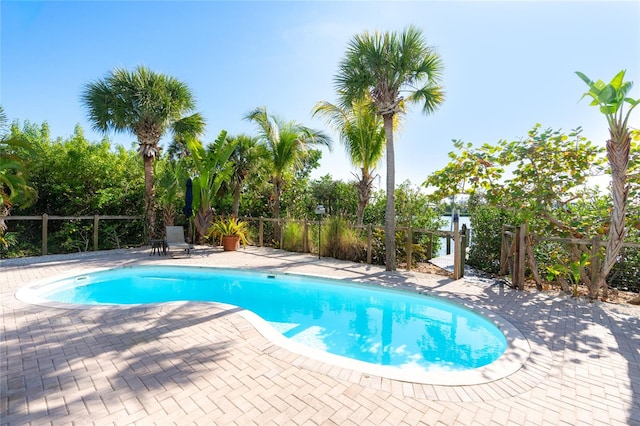 view of swimming pool with a patio area