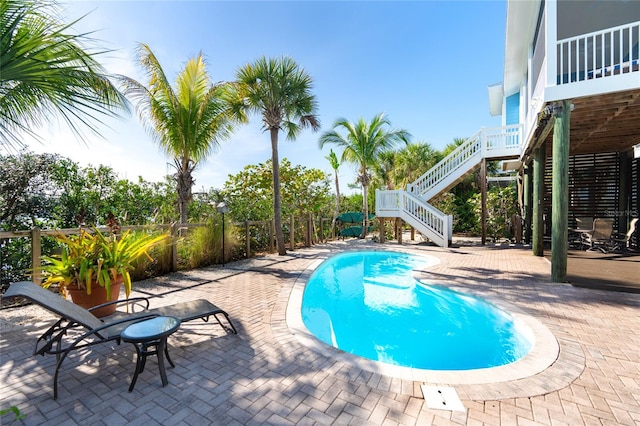 view of pool featuring a patio area