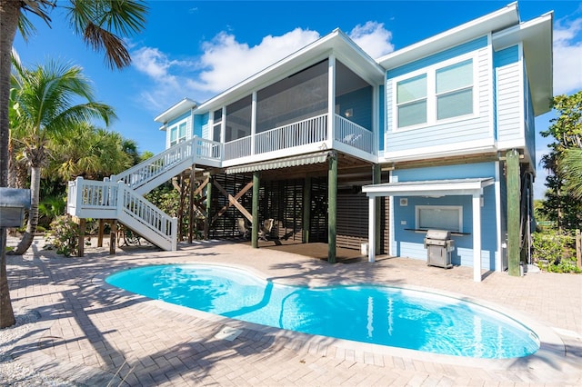 rear view of property featuring a patio area