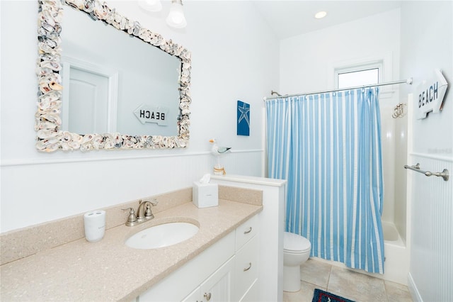 full bathroom with shower / bath combo, toilet, tile patterned floors, and vanity