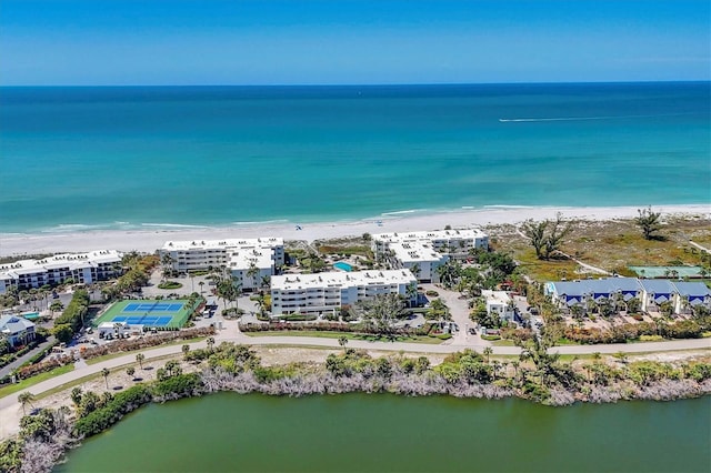 bird's eye view with a view of the beach and a water view