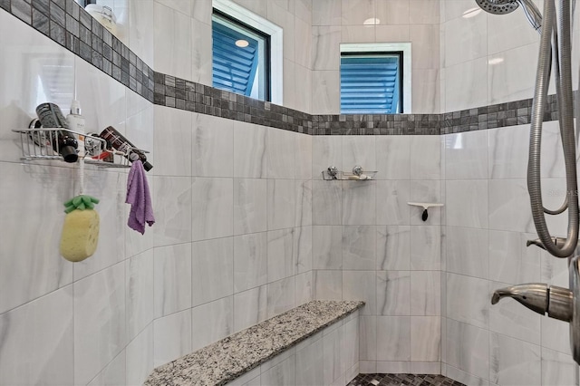 bathroom featuring tiled shower