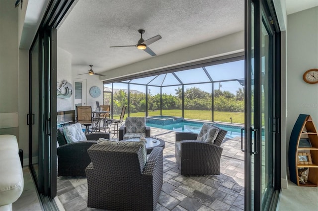 sunroom / solarium with ceiling fan