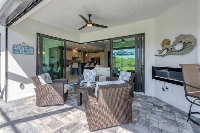 view of patio / terrace with an outdoor hangout area and ceiling fan