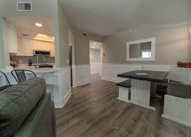 dining space with dark wood-type flooring