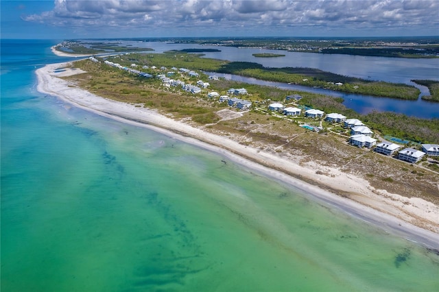 bird's eye view featuring a view of the beach and a water view