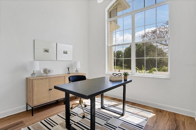 office area with light hardwood / wood-style flooring