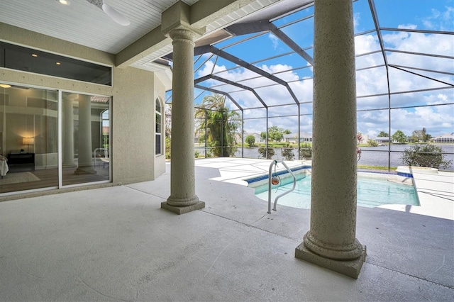 view of swimming pool with a patio and a lanai