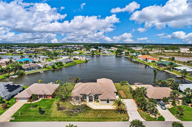 birds eye view of property featuring a water view