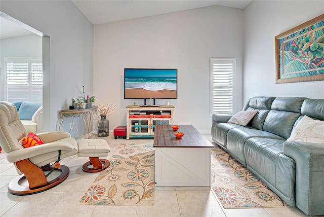 living room with light tile floors and lofted ceiling