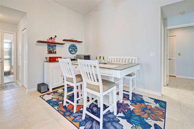 dining area with light tile floors