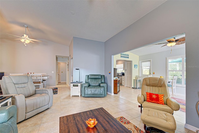 tiled living room with vaulted ceiling and ceiling fan