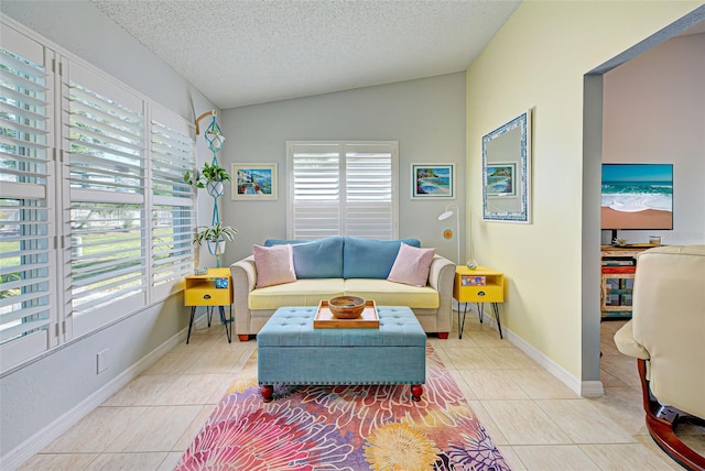 tiled living room with a textured ceiling and vaulted ceiling