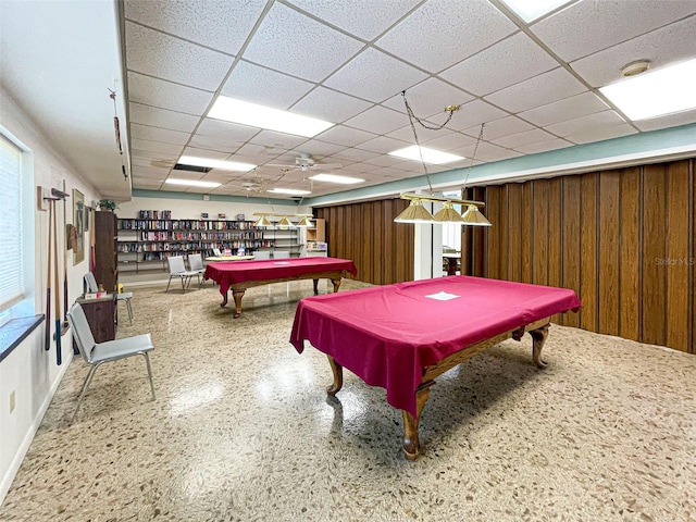 game room with a paneled ceiling and pool table