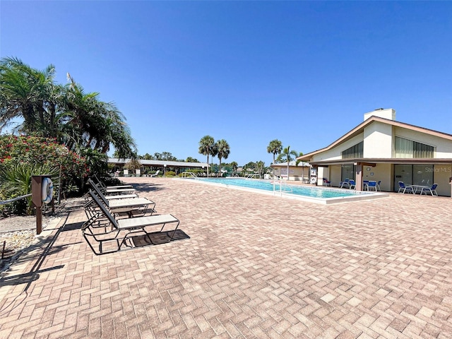 view of swimming pool with a patio