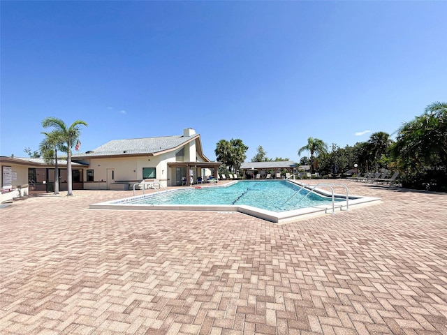 view of swimming pool featuring a patio