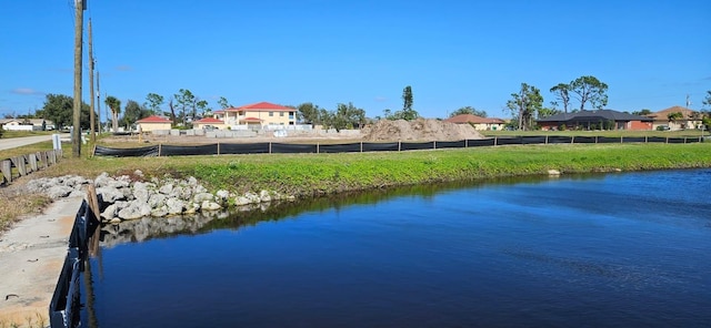 view of water feature with fence