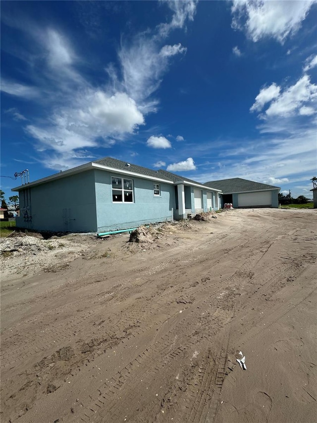 view of front of home featuring stucco siding