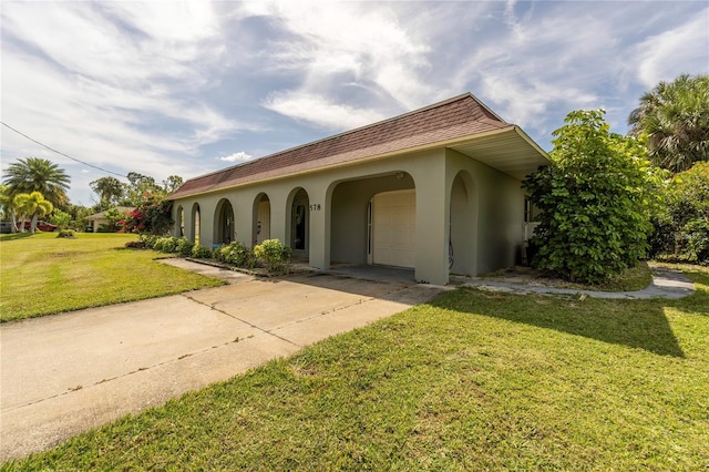 mediterranean / spanish-style home with a front yard