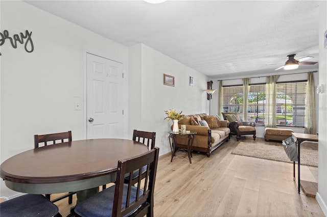 dining space featuring ceiling fan and light hardwood / wood-style flooring