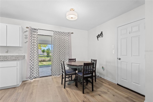 dining room with light wood-type flooring