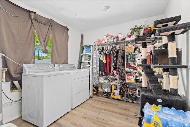 washroom featuring washer and dryer and light wood-type flooring