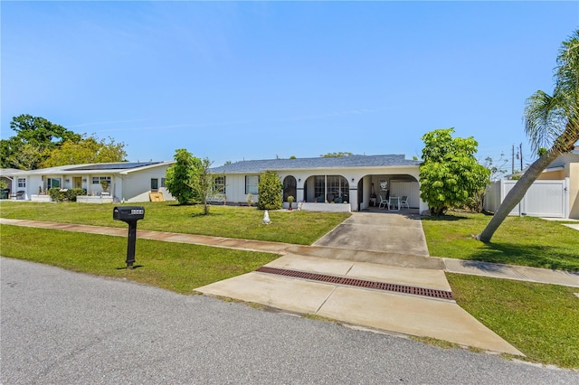 single story home with a carport and a front yard