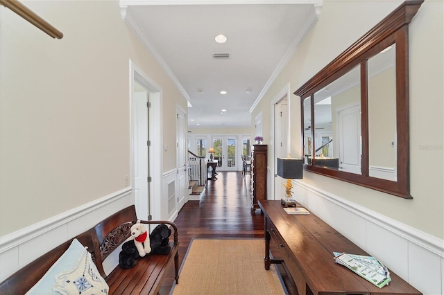 corridor with crown molding, french doors, and dark hardwood / wood-style flooring