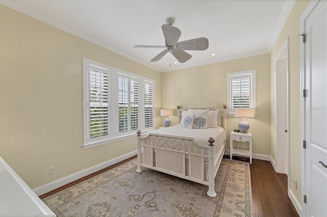 bedroom with multiple windows, dark wood-type flooring, ornamental molding, and ceiling fan