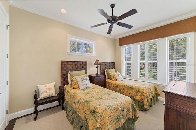 bedroom with ceiling fan, ornamental molding, and multiple windows