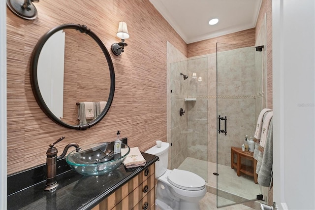 bathroom with toilet, a shower with shower door, and vanity