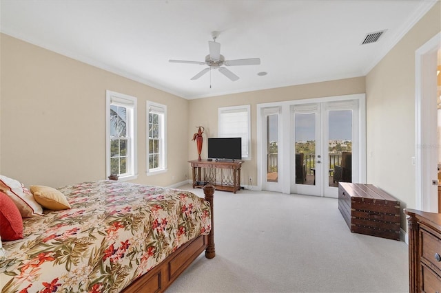 carpeted bedroom featuring ceiling fan, ornamental molding, access to outside, and french doors