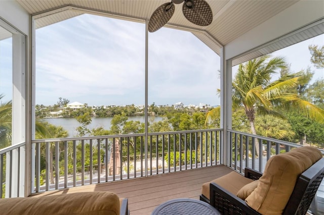 exterior space with a water view and ceiling fan