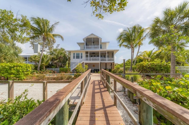 rear view of property featuring a balcony