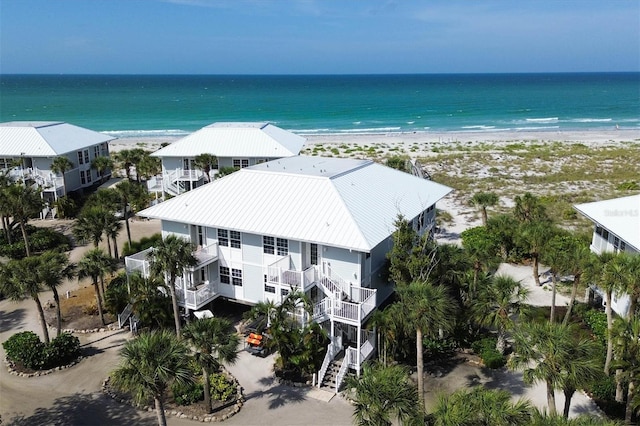 aerial view featuring a water view and a view of the beach