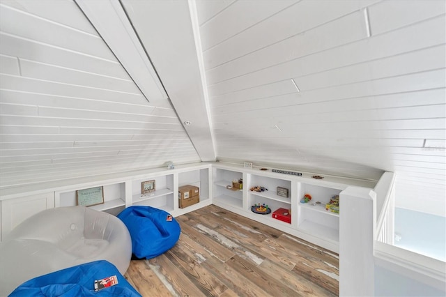 rec room featuring lofted ceiling and hardwood / wood-style flooring