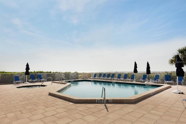 view of pool featuring a patio