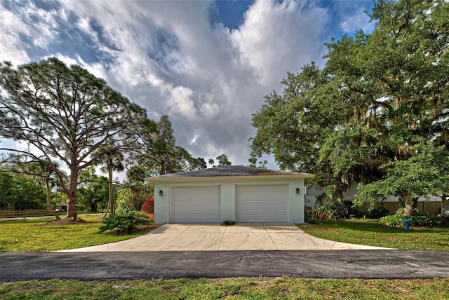 garage featuring a yard