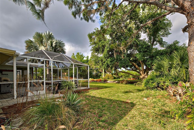 view of yard with a lanai