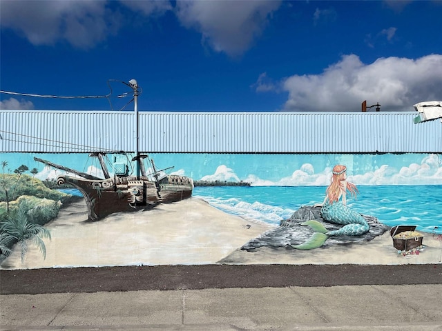 view of pool featuring a water view