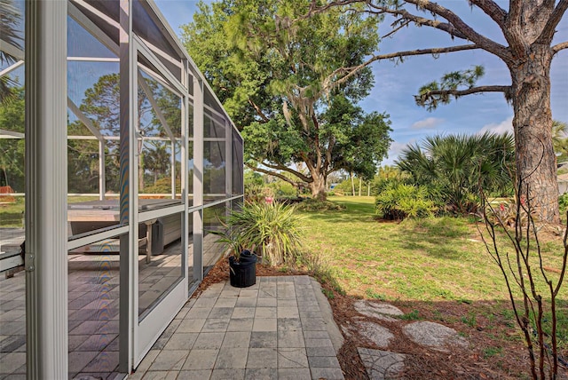 view of yard with a patio area and a lanai